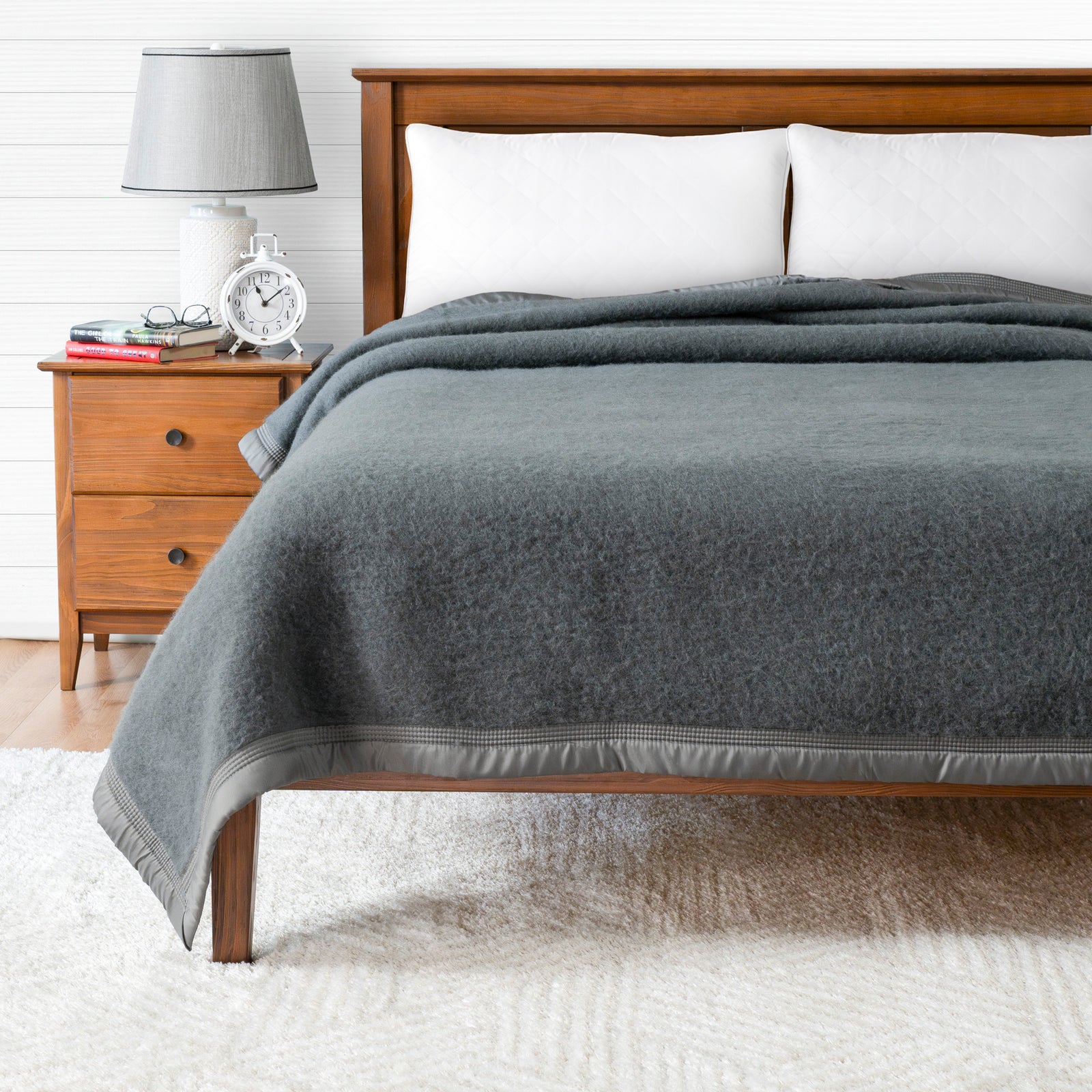 Aurora-wool-blanket-700gsm-blue-poyet motte bed in room